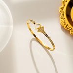 18K gold plated Art Deco fan bangle with pearl and crystals by Biya Accessoires.