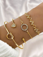 Waterproof 18K gold luxury heart and infinity bracelet stack Biya Accessoires UAE.