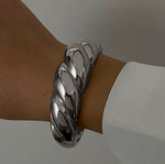 Luxury tarnish-free stainless steel sculptural jewelry for sensitive skin.