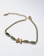 Hypoallergenic non-tarnish high polish gold green crystal station bangle UAE.