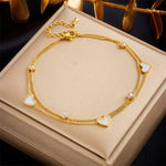 Waterproof gold layered crystal and white heart charm bracelet for women Dubai.