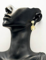 Close up of premium hypoallergenic imitation jewelry featuring a crystal circle and luminous stone.