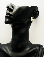 Close-up of premium hypoallergenic imitation jewelry featuring a romantic gold heart design.