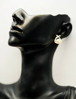 Close-up of premium hypoallergenic imitation jewelry featuring an overlapping gold frame.