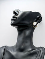 Everyday luxury fashion jewelry gold tone statement studs by Biya Accessoires Dubai.