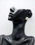 Close-up of premium hypoallergenic imitation jewelry featuring a celestial pearl design.