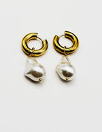 Biya Accessoires 18K gold plated baroque pearl drop hoop earrings.