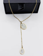 Biya Accessoires 18K gold plated lariat necklace with teardrop pave crystal pendants.