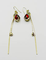 Biya Accessoires artificial jewellery online dubai Ruby Red peacock crystal tassel earrings.