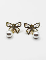 Biya Accessoires artificial jewellery online dubai crystal pavé butterfly pearl earrings.