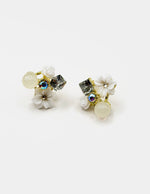 Close up of elegant imitation jewelry uae featuring white flowers and clear crystals.