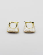Biya Accessoires artificial jewellery online dubai white marble geometric hoops.