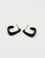 Biya Accessoires glossy caramel brown C curve stud earrings.