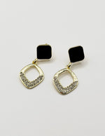 Biya Accessoires gold black enamel and crystal rhombus drop earrings.