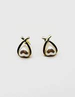 Biya Accessoires gold criss cross stud earrings with triangular pearl.