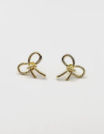 Best fashion jewelry in UAE woven gold ribbon earrings.