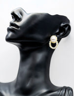 Close-up of premium hypoallergenic imitation jewelry featuring a braided gold frame.