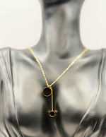 Waterproof non-tarnish artificial gold jewelry with dual black medallion pendant.