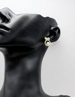 Close-up of premium hypoallergenic imitation jewelry featuring a large white pearl.