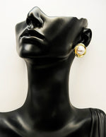 Everyday luxury fashion jewelry gold tone statement studs by Biya Accessoires Dubai.