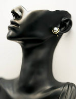 Best fashion jewelry in UAE organic shape gold and silver earrings.