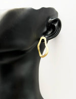 Close-up of premium hypoallergenic imitation jewelry featuring a modern open-frame design.