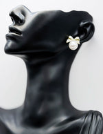 Best fashion jewelry in UAE bow-shaped crystal earrings in white-gold pearl.