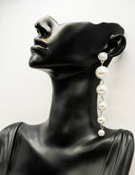 Close-up of premium hypoallergenic imitation jewelry featuring a linear pearl cascade.