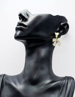 Everyday luxury fashion jewelry gold tone geometric drops by Biya Accessoires Dubai.