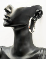 Close up of premium hypoallergenic imitation jewelry featuring a sleek twisted design.