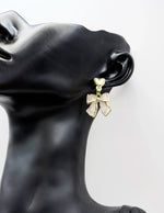 Elegant enameled bow statement earrings for women.