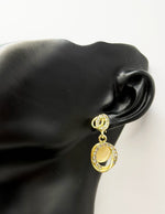 Everyday luxury fashion jewelry gold tone geometric drops by Biya Accessoires Dubai.