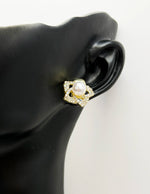 Close-up of premium hypoallergenic imitation jewelry featuring a swirling petal design.