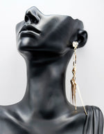 Biya Accessoires gold fringe and crystal drop earrings.