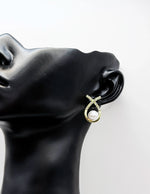 Everyday luxury fashion jewelry gold tone pearl drops by Biya Accessoires Dubai.