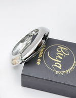 Silver bracelet on a black box with 'Bija' branding