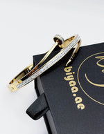 Waterproof 18K gold nail bangle with pave crystals Biya Accessoires UAE.