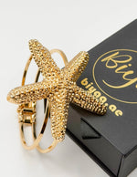 Hypoallergenic gold plated sea star open bracelet United Arab Emirates.