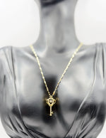 Waterproof gold key necklace with marquise crystals in luxury gift box.