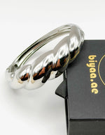 Luxury tarnish-free stainless steel sculptural jewelry for sensitive skin.