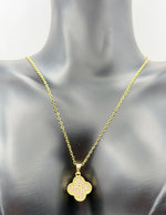 Gold necklace with a pendant on a mannequin