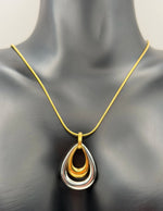 Modern luxury two tone hollow teardrop necklace Dubai.