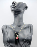 18K gold plated reversible red and crystal clover necklace by Biya Accessoires.