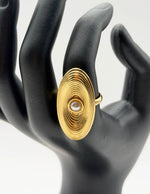 Waterproof gold concentric circle shield ring with pearl Dubai.