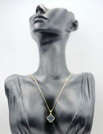 18K gold plated reversible black and crystal clover necklace by Biya Accessoires.