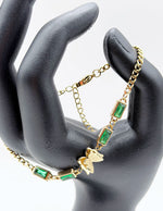 18K gold plated emerald green crystal and butterfly bracelet by Biya Accessoires.