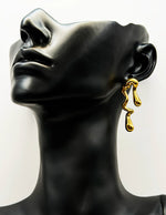 Close-up of premium hypoallergenic imitation jewelry featuring an organic molten design.