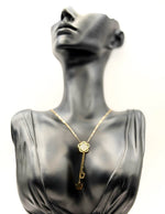 Biya Accessoires 18K gold plated flower lariat necklace with mother of pearl inlay.