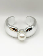Non-tarnish thick silver statement bangle with oversized pearl Dubai luxury fashion.