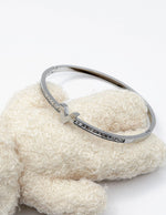 silver plated V motif chevron crystal bangle by Biya Accessoires.